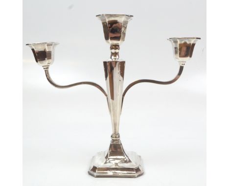 JAMES DEAKIN &amp; SONS; a George V hallmarked silver triple sconce twin branch candelabrum on loaded octagonal base, Chester