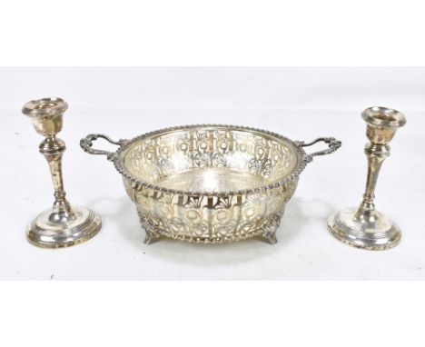 ADIE BROS LTD; a George V hallmarked silver twin handled foliate motif pierced bowl with cast rope twist rim, raised on four 