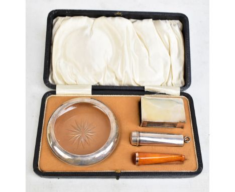 HENRY WILLIAMSON LTD; a cased George V hallmarked silver and silver mounted smoking set comprising clear glass ashtray, match