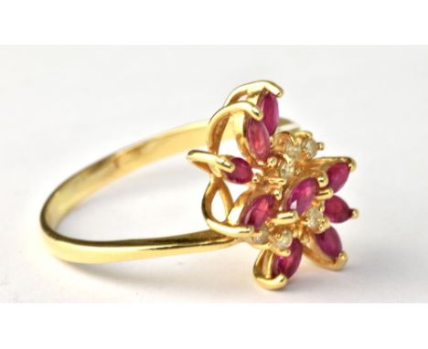 A yellow metal floral motif dress ring set with pink and white coloured stones, stamped '18K 750' to band interior, size T, a