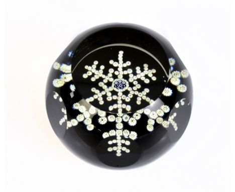 WHITEFRIARS; a limited edition faceted glass paperweight, 'Snow Crystal', dated 1981, diameter 7cm.Additional InformationLigh