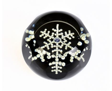 WHITEFRIARS; a limited edition faceted glass paperweight, 'Snow Crystal', dated 1981, diameter 7cm.Additional InformationLigh