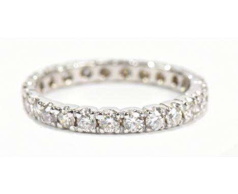 An 18ct white gold and diamond full eternity ring, diamond weight approx 0.62cts, size O 1/2, approx 2.4g, sold with receipt 