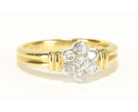 An 18ct yellow gold seven stone diamond floral cluster ring totalling approx 0.33cts, size M, approx 4.5g.