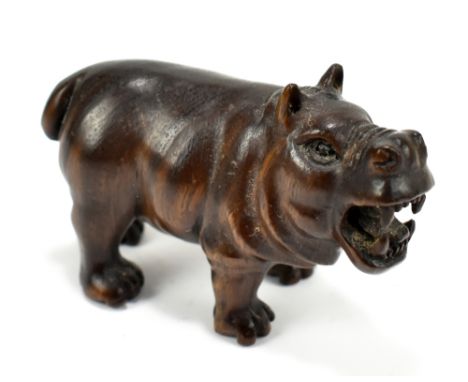 A Japanese carved hardwood netsuke modelled as a hippo, with twin character mark, length 5.5cm.Additional InformationGeneral 