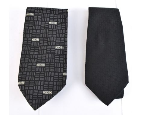 MOSCHINO; a black patterned silk tie with Moschino logo and a Christian Dior black and red lined silk tie (2).