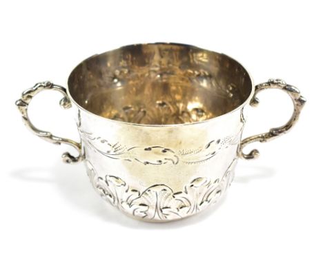 A James II hallmarked silver twin handled porringer, with scrolling handles, upper band of embossed decoration and lower band