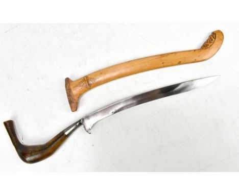 A north Sumatran rencong dagger (also known as a hulu meucangge) with horn hilt and floral decorated wooden scabbard, length 