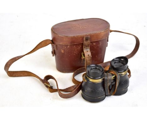 A pair of military issue binoculars stamped 'REF. number GE/338' in original case inscribed to top 'AM Ref. No. 6E-338 binocu