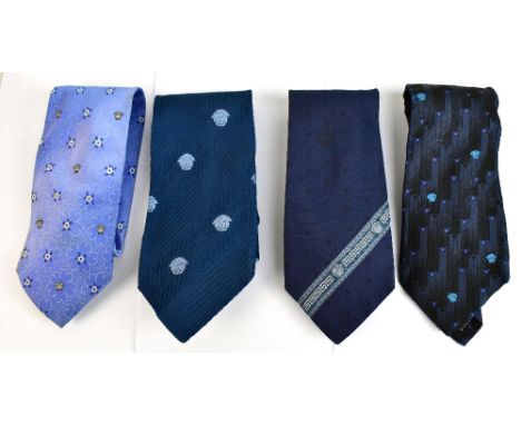VERSACE; a light blue 100% silk tie, a dark blue silk tie, a black with purple and blue pattern silk tie and a navy blue with