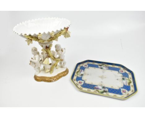 A 19th century white glazed ceramic centrepiece with moulded Cupids playing instruments, further floral and gilt detail, impr