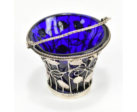 DAVID BELL; a George III hallmarked silver swing handled basket with blue glass liner and pierced foliate detail, London (pro