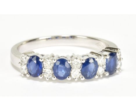 An 18ct white gold sapphire and diamond ring with four oval sapphires totalling approx 1ct and ten diamonds totalling approx 