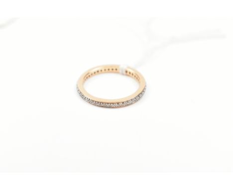 An 18ct yellow gold diamond full eternity ring, size K 1/2, approx 2.1g.