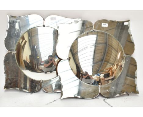 A pair of floral motif mirrors with convex centre panes, each approx 51 x 48.5cm (2).Additional InformationLight general wear