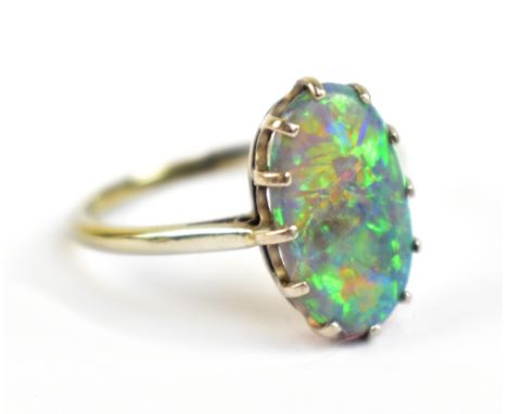 A white metal and black opal ring, the band stamped 18, approx 2.6g, size P.Additional InformationThis is not a dublet or tri