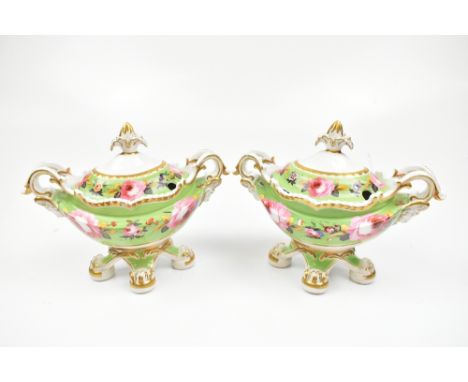 CHAMBERLAINS WORCESTER; a pair of hand painted twin handled lidded tureens, painted with roses and floral detail on a green g