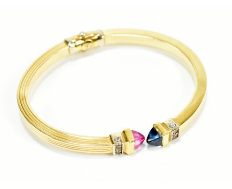 An 18ct yellow gold diamond set hinged snap bangle, external width 6.5cm, approx 14.3g.