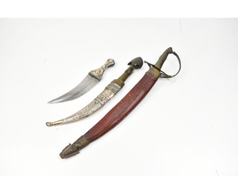 A Jambiya with white metal scabbard and horn hilt, length 38cm, a small example lacking scabbard and a small side arm with me