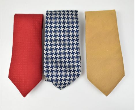 HERMÉS; a red silk tie with Hermés embellished logo, a Hilditch &amp; Key navy and silver silk tie, and a Smyth &amp; Gibson 