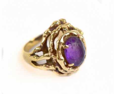 A yellow metal amethyst dress ring with openwork setting, stamped 9ct, approx 8g, size K.