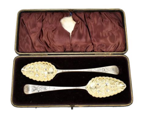 PETER &amp; ANN BATEMAN AND DUNCAN URQUHART &amp; NAPHTALI HART; a matched pair of George III hallmarked silver berry spoons,