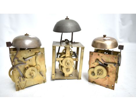 Three unmarked brass longcase clock movements with bells (3).