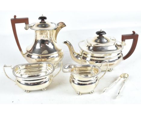 An Elizabeth II four piece hallmarked silver tea service, Birmingham 1958, approx 49.7oxt/1546.6g.