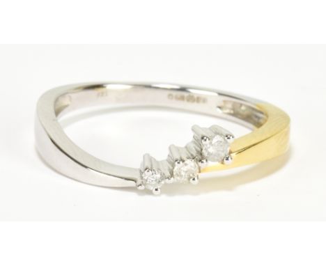 A 9ct yellow and white gold three stone diamond ring, size M, approx 2g.