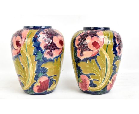 FREDERICK RHEAD FOR BURSLEY WARE; a near pair of 'Seed Poppy' tubeline decorated ovoid vases, printed marks to base, tallest 