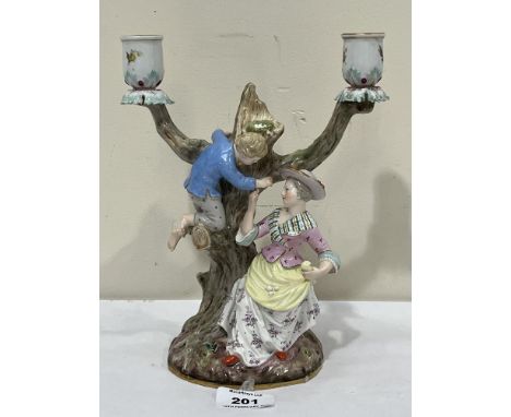 A 19th Century Dresden porcelain two light figure group candelabrum. Crossed swords in underglaze blue. 9½" high
