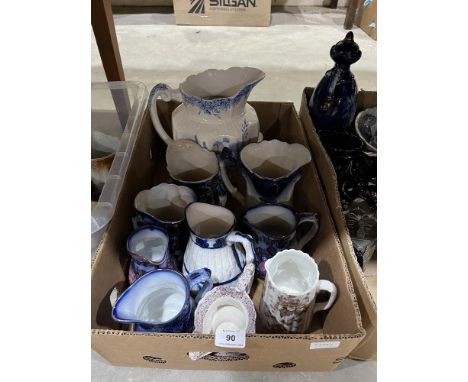 Three boxes of ceramic jugs.