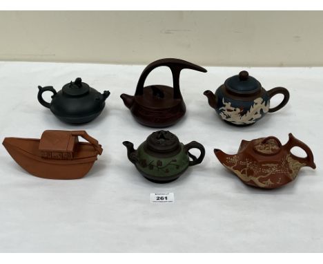 Six Chinese ceramic teapots.
