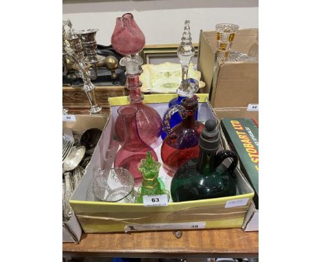 A blue glass bell; a cranberry glass decanter and other glassware.