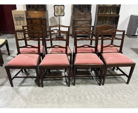 A 19th Century set of eight mahogany dining chairs with pierced ladder backs, on square tapered legs.