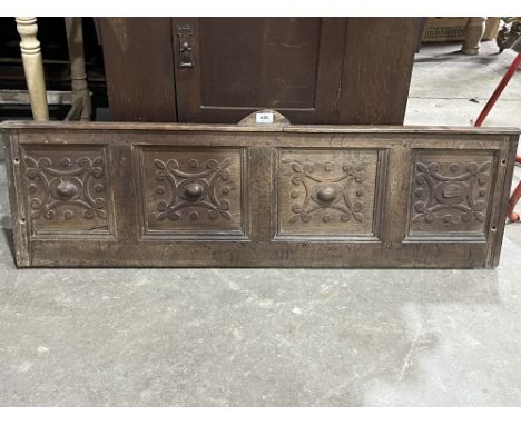 A late 17th Century joined oak carved panel. 47" wide.