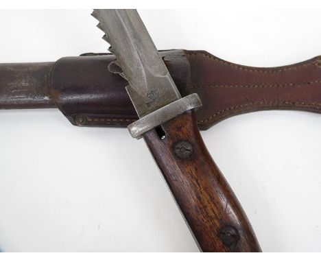 A German MI884/98 sawback bayonet by Gebruder Heller of Marienthal and marked Erfurt, with scabbard and leather frog 