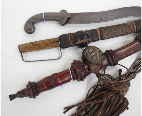 A 19th Century Indo-Persian all steel sword with wavy blade, together with two other eastern examples (one stuck in scabbard)