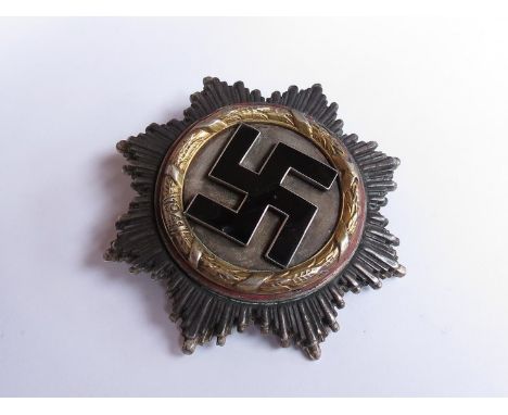 A German pattern cross in gold with maker's marked on pin Deschler & Sohn. Munchen, with four rivets, some light age and wear