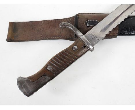 A WWI German Seitengewehr 98/05 nA sawback bayonet by Waffenfabrik together with scabbard and brown leather frog, dated W16