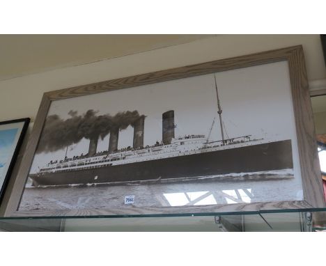 A print of the Lusitania, oak framed 