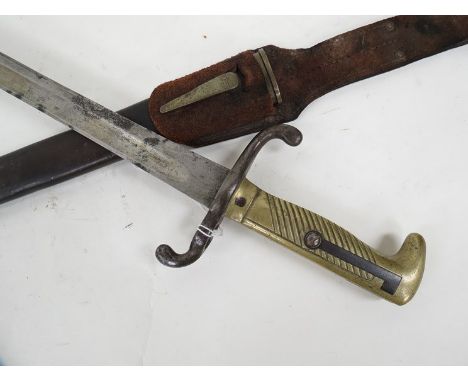 An 1875 Prussian army bayonet with Solingen blade, scabbard and leather belt frog