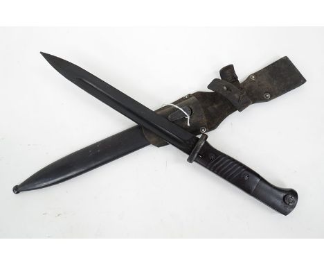 A German K98 bayonet marked 43 ASW and 7347 to blade, with scabbard and leather frog 