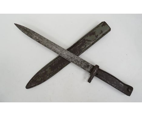 A WWI German Ersatz bayonet with green painted scabbard