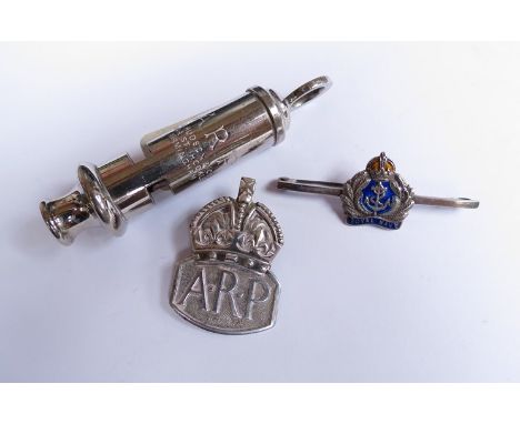 A silver ARP badge, ARP whistle and silver Royal Navy brooch (3)