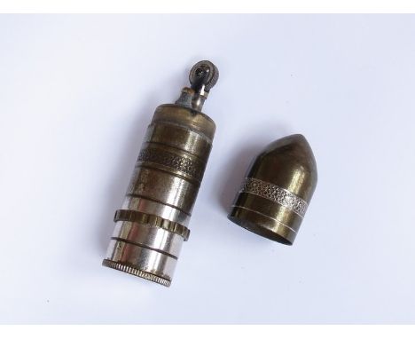 A Continental plated brass cigarette lighter of bullet form 