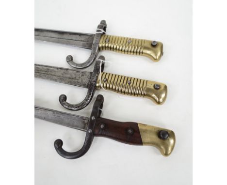 Two late 19th Century French Chassepot bayonets including 1872 dated, together with an epeé bayonet with scabbard (3)