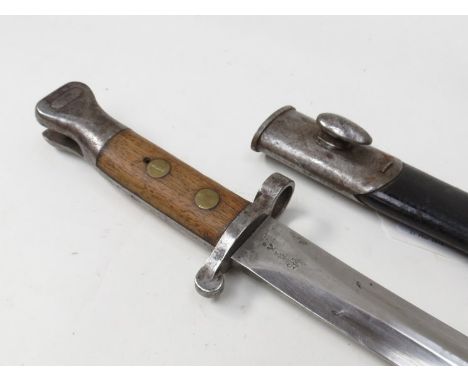 A British pattern 1888 Mk I second type Enfield bayonet with various markings together with scabbard bearing EFD stamp