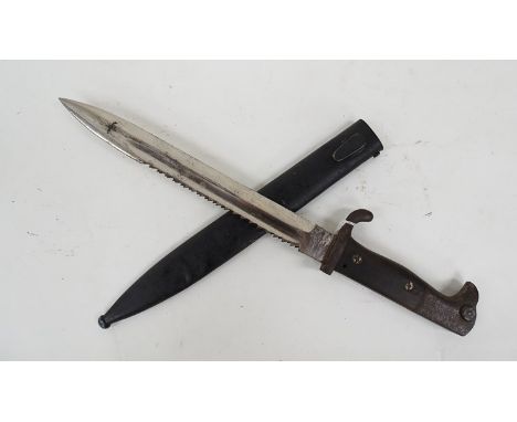 A German sawback bayonet (short type) by Move Werke Walter & Co Mulhauser in Thr, chromed blade with scabbard marked 5102