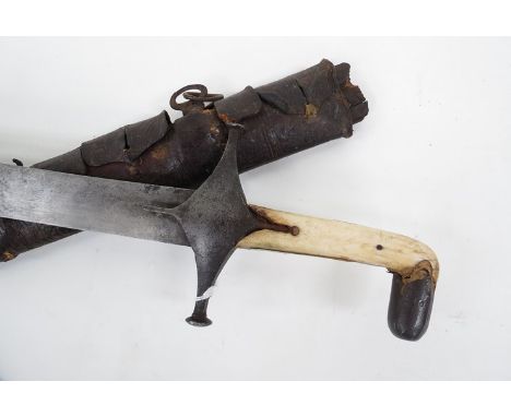 A 19th Century Mameluke sword with bone grips iron cross guard, the curved blade with double edged yelman towards the point, 